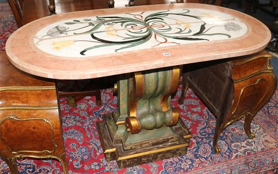 An Italian table with pietra dura oval marble top, raised on a gilt and green single scrolled pedestal (damage to edge of top) W.140cm